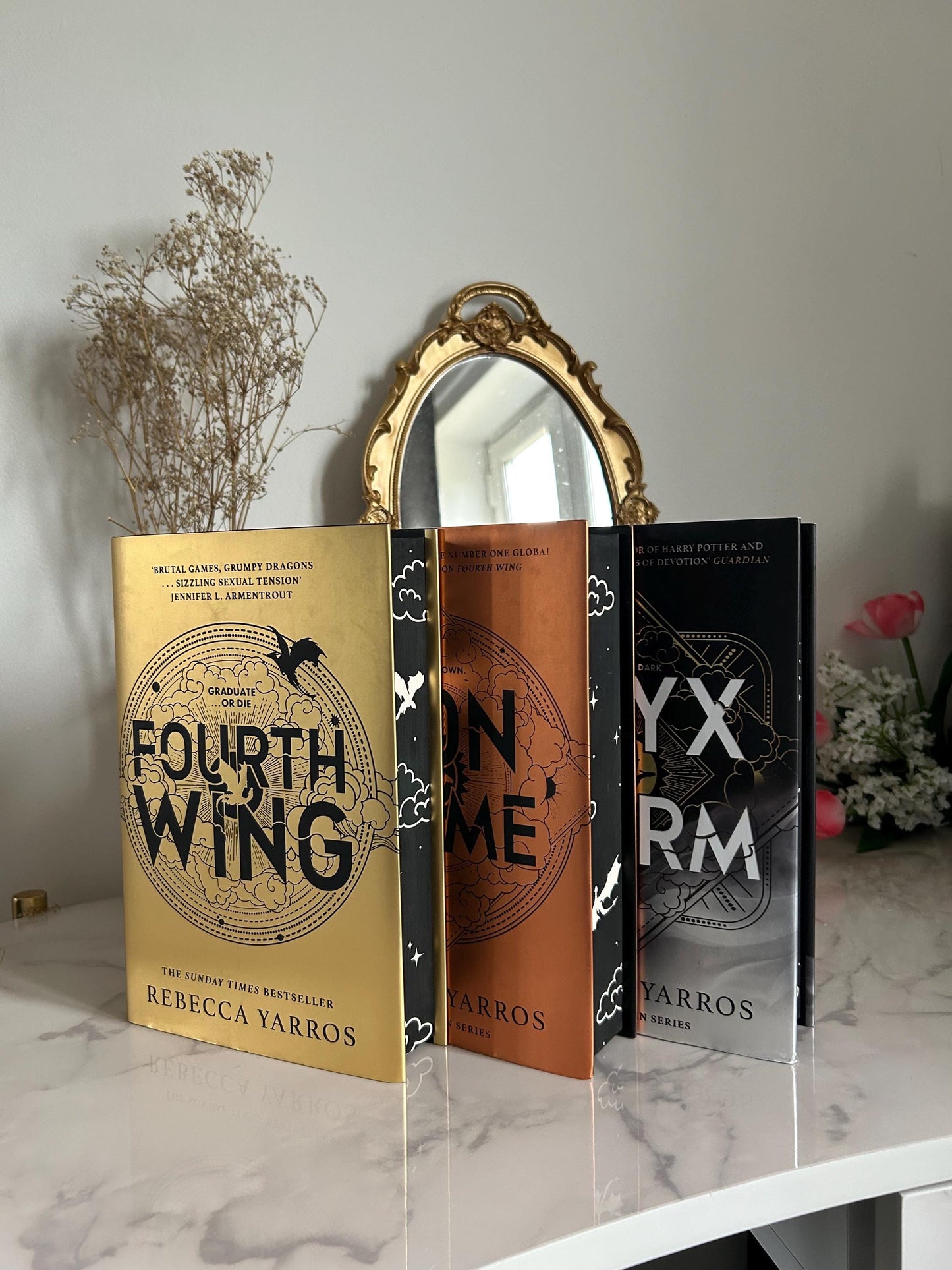 Fourth Wing, Iron Flame and Onyx Storm by Rebecca Yarros with sprayed edges